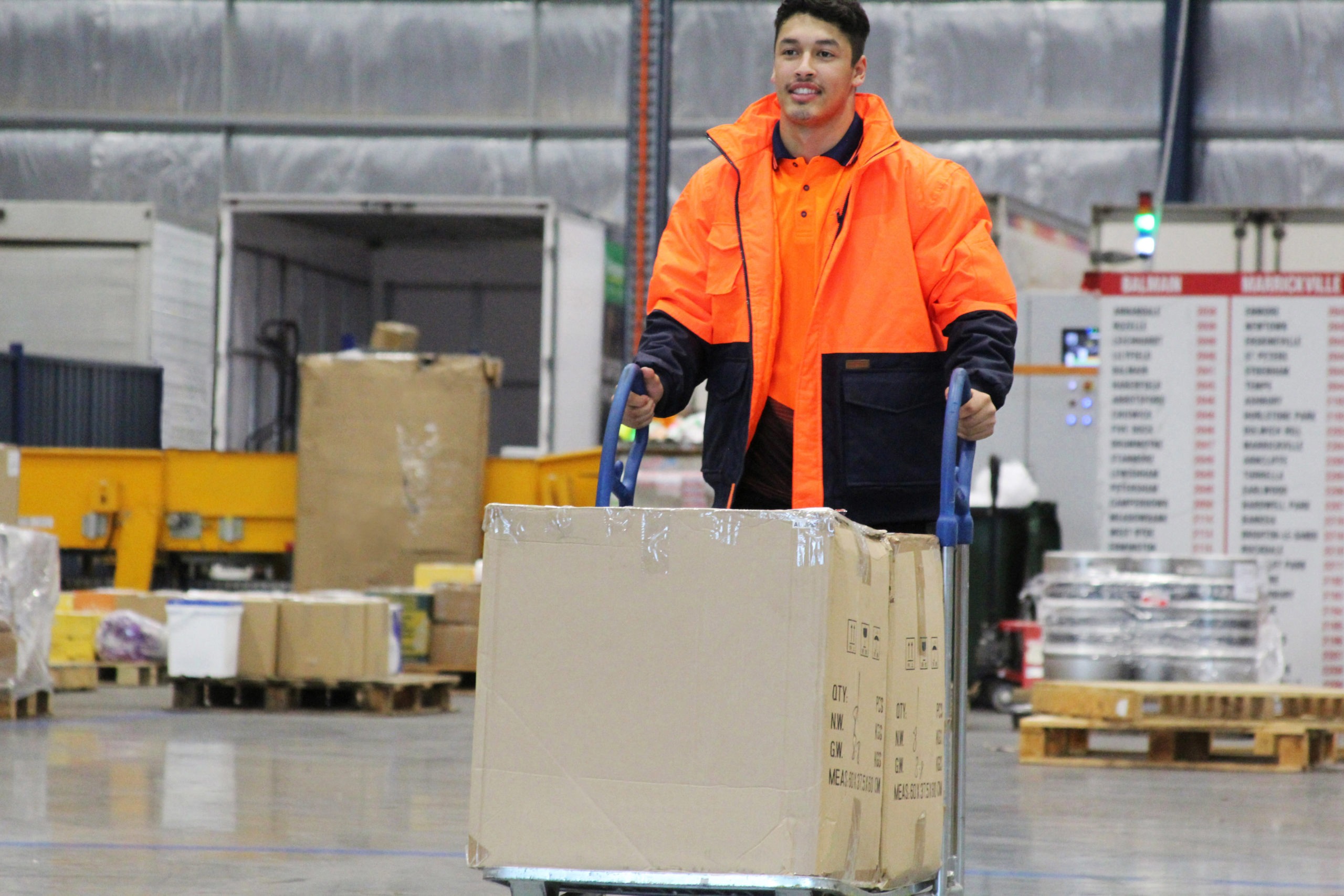 Guy-with-trolley-and-parcels-scaled.jpg